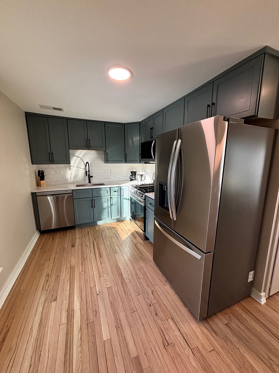 Cook in the remodeled kitchen with full size appliances, counter space for prep, and plenty of cabinets for storage.