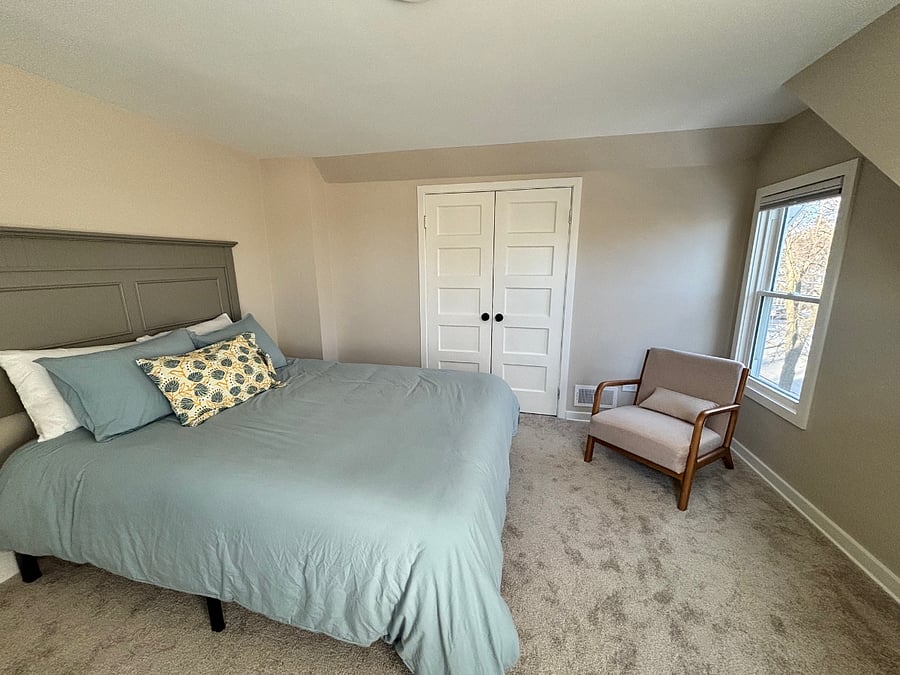 The main bedroom has a king bed, reading nook, and large closet.