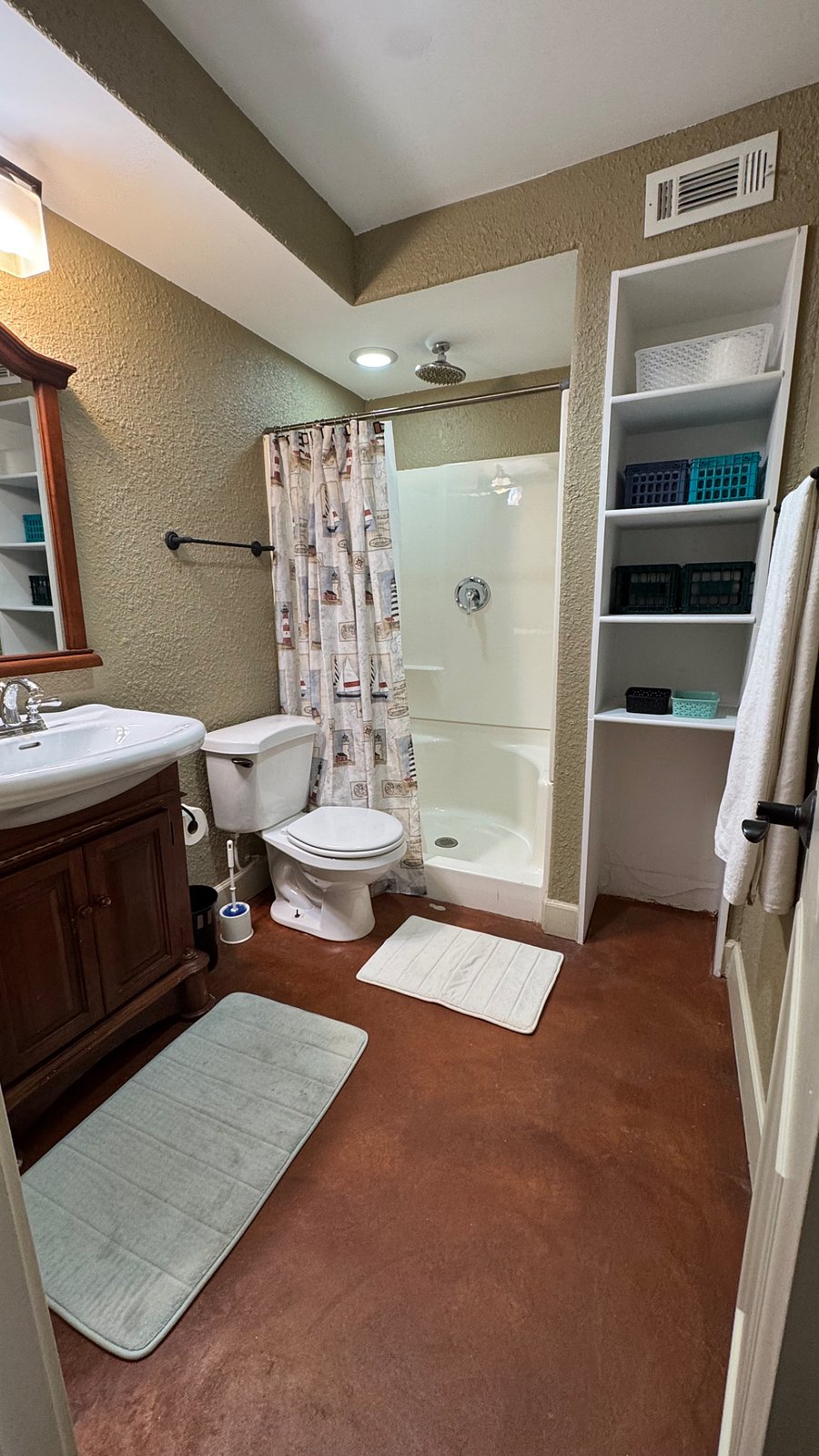 Full Private Bathroom with walk-in rain shower head and lots of storage space!