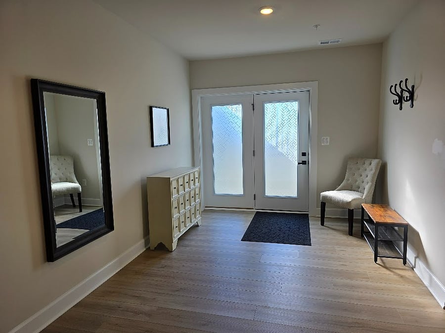Large, private entryway offers space for you to settle in when you arrive home