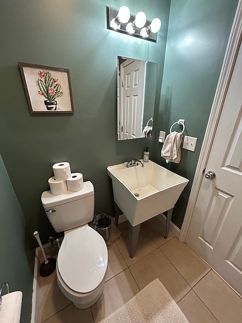 Full bathroom with utility sink