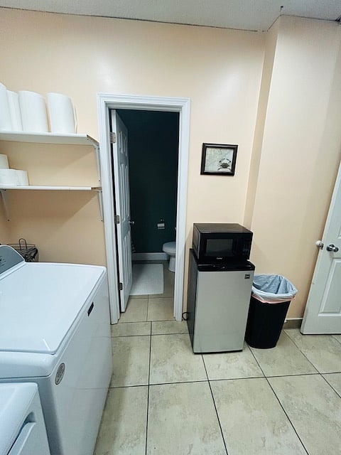 Entrance to full bathroom off of laundry room.