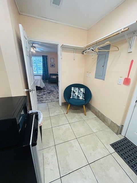 Laundry room with seating.