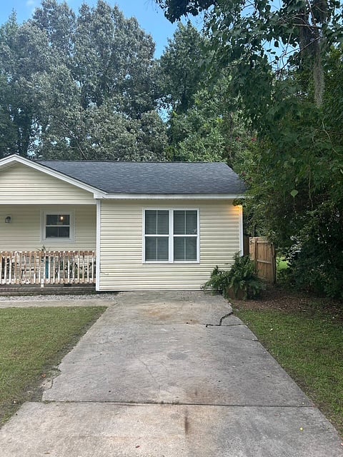 Exterior of the guest suite with full driveway for guest use. 