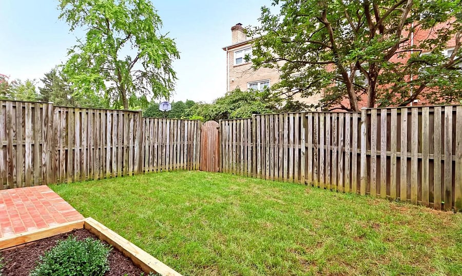 Walkout backyard and patio area with direct access to main road and street parking.