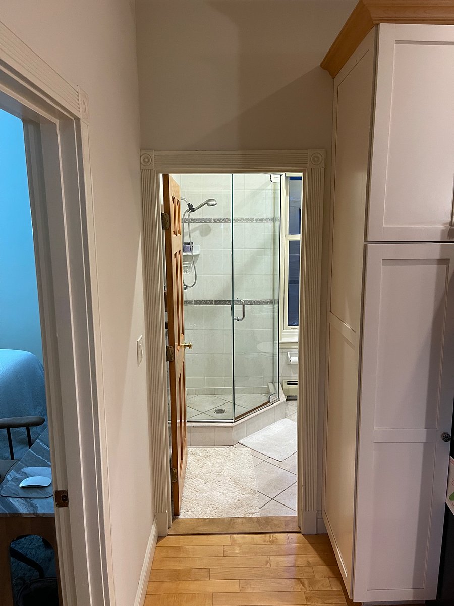 Private bathroom shares wall with main private bedroom