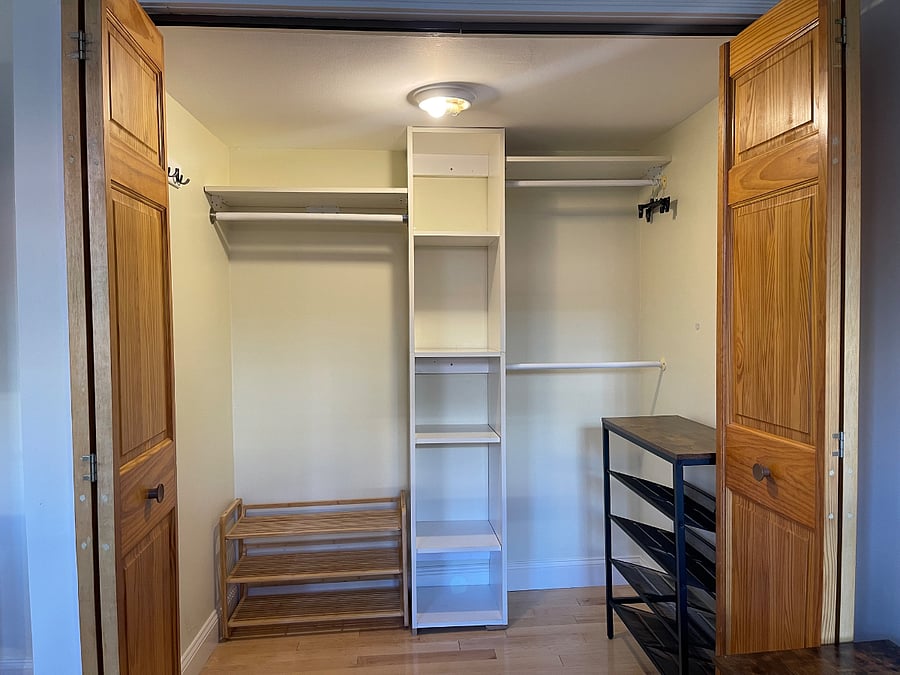 Walk-in closet with shelving and storage