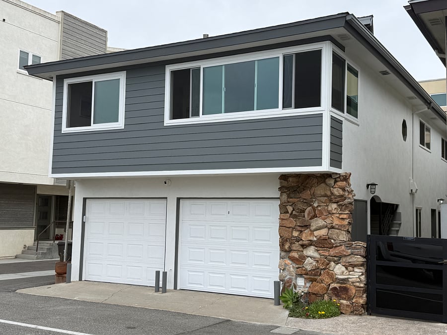 The front of the building has new siding and new front windows.