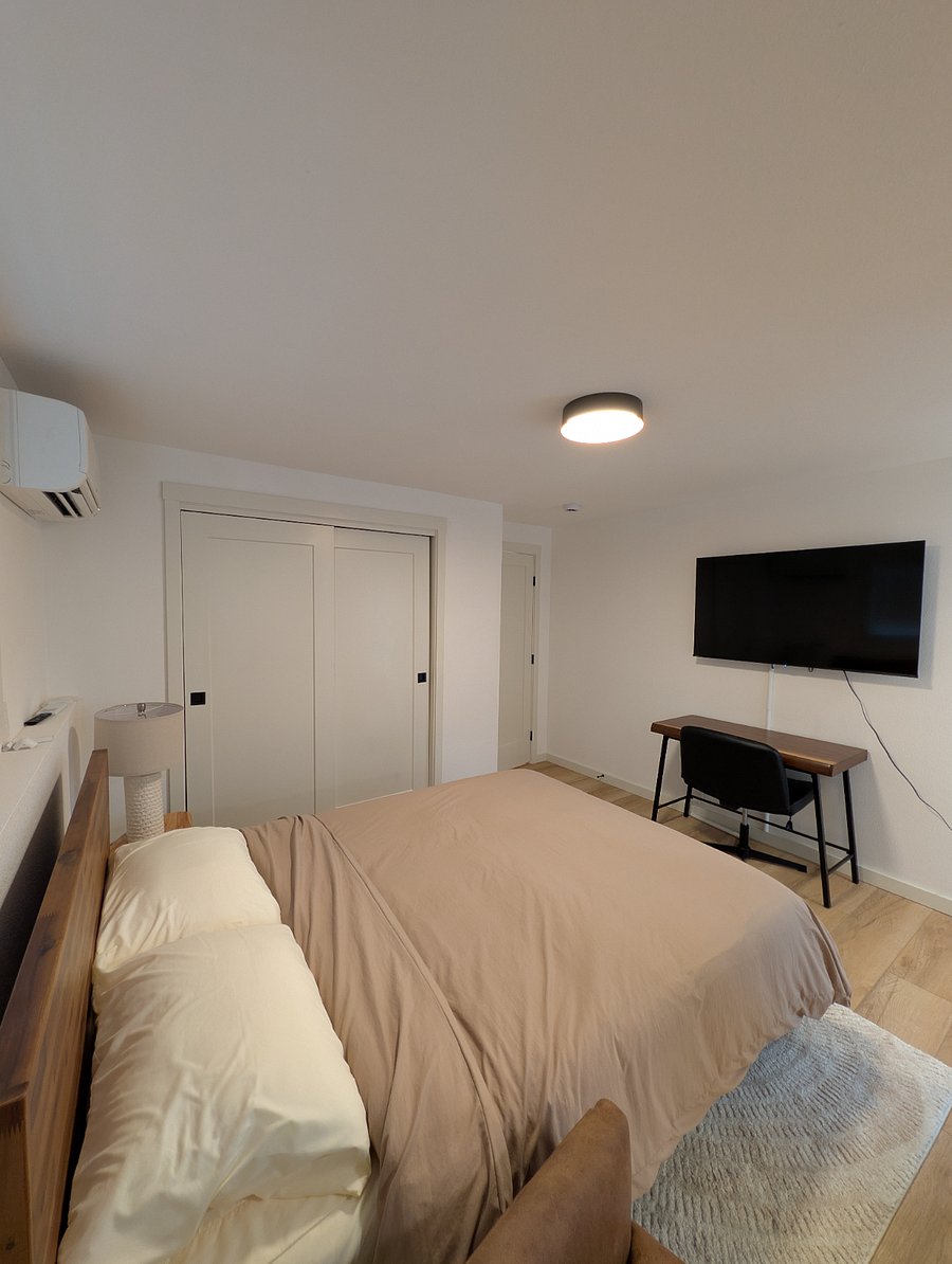 Dedicated workspace, smart TV, wall mounted mini-split remote controlled thermostat heating and cooling.