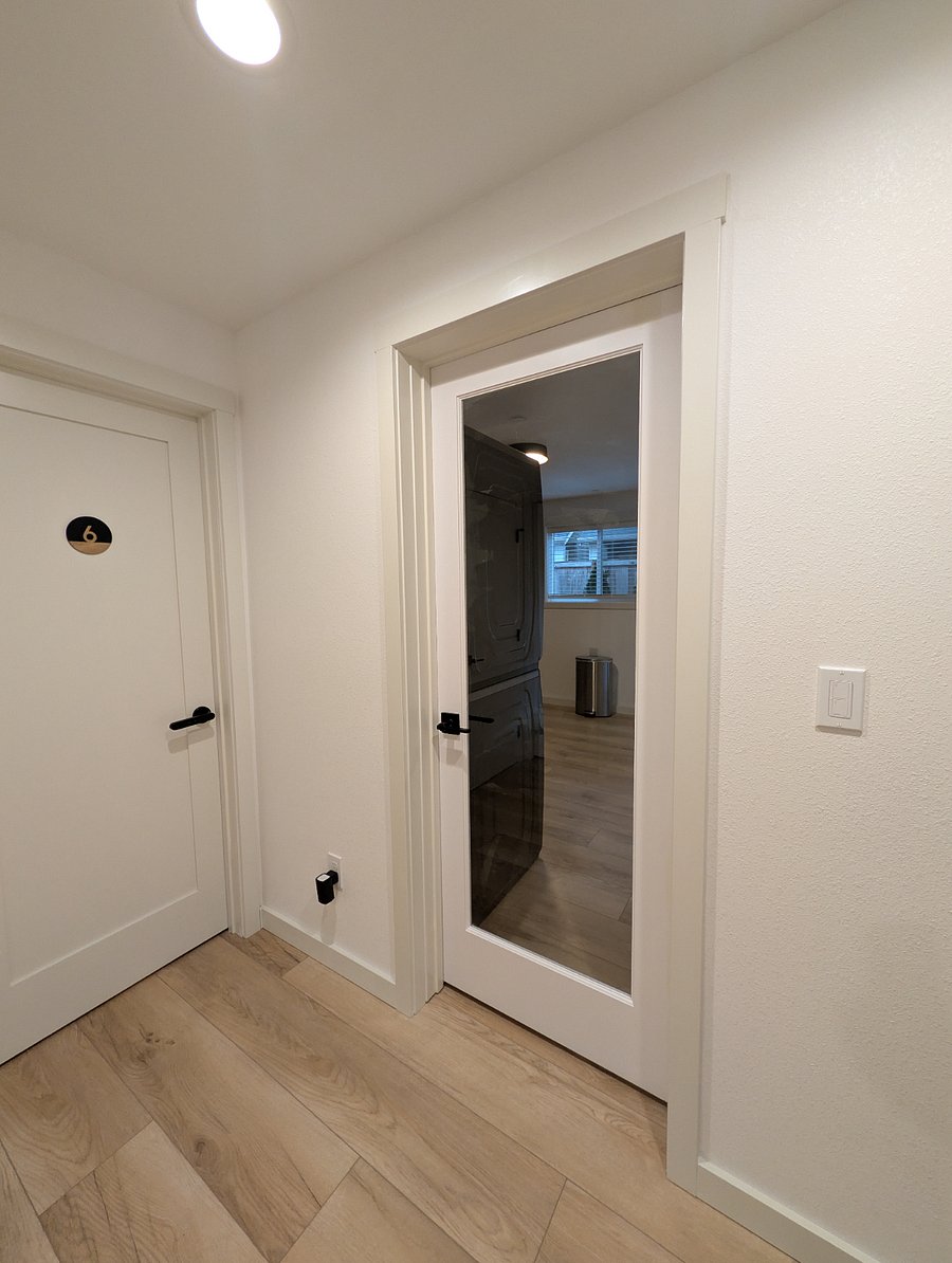 interior door to laundry/kitchenette