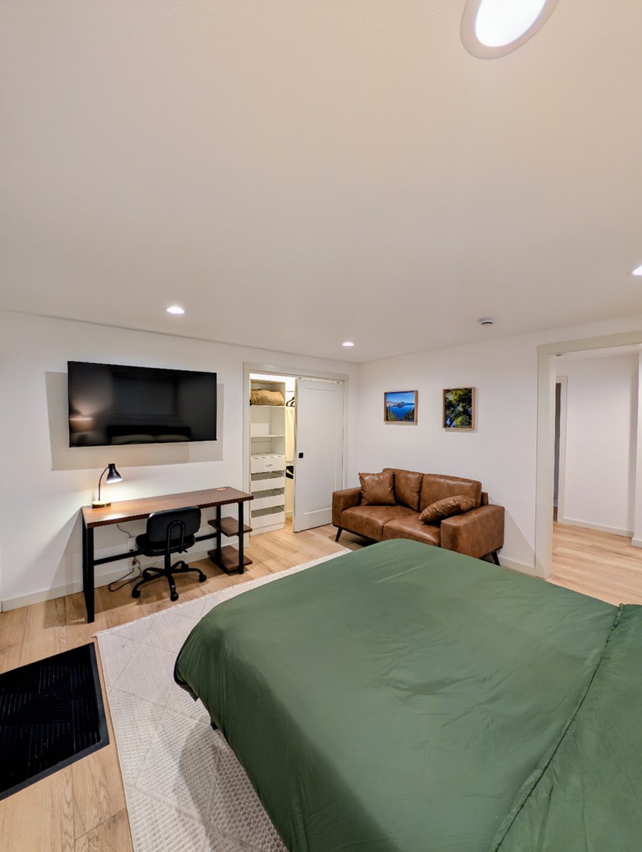 Dedicated workspace, smart TV, couch, closet with built-in wardrobe.