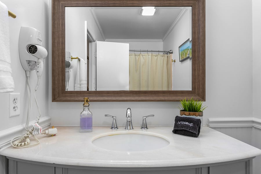Full Bath in the private main-level primary suite. (Accessible to only Bedroom 1)