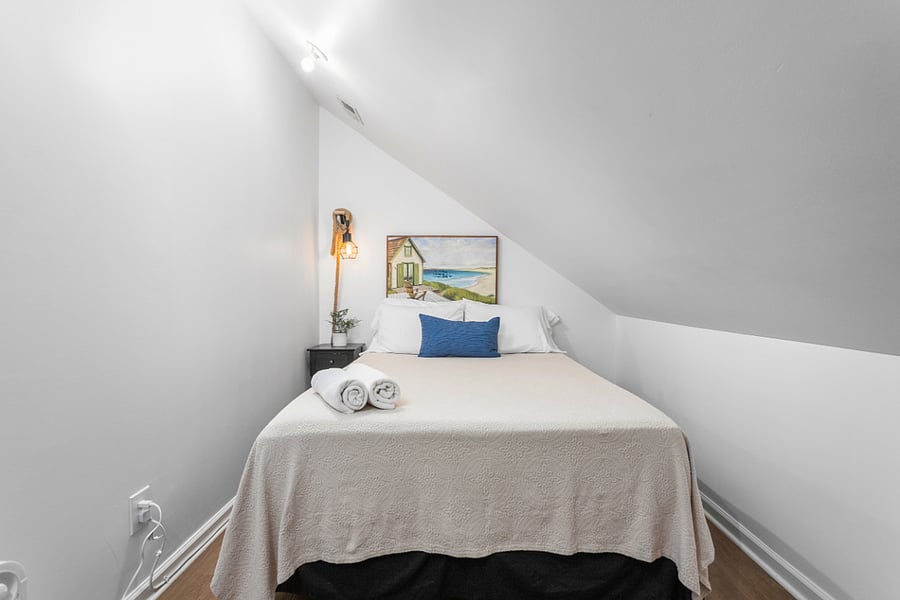 Upstairs on the second floor the Bonus Room located on the right side of the hallway.

Bonus Room: featuring a full size bed, smart TV. Slightly smaller compared to other bedrooms. Perfect for extra guests or kids.
