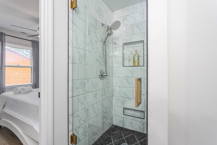 Full Size Bathroom connecting with Bedrooms 2 and 3, and cam be shared with Bedroom 4.

Walk-in Shower with glass door

Exiting Bathroom into Bedroom 3