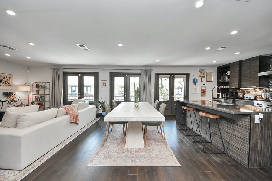 Enjoy group meals in style. This bright, open dining area features a bold contemporary table, comfortable seating, and seamless flow right into the kitchen and living spaces