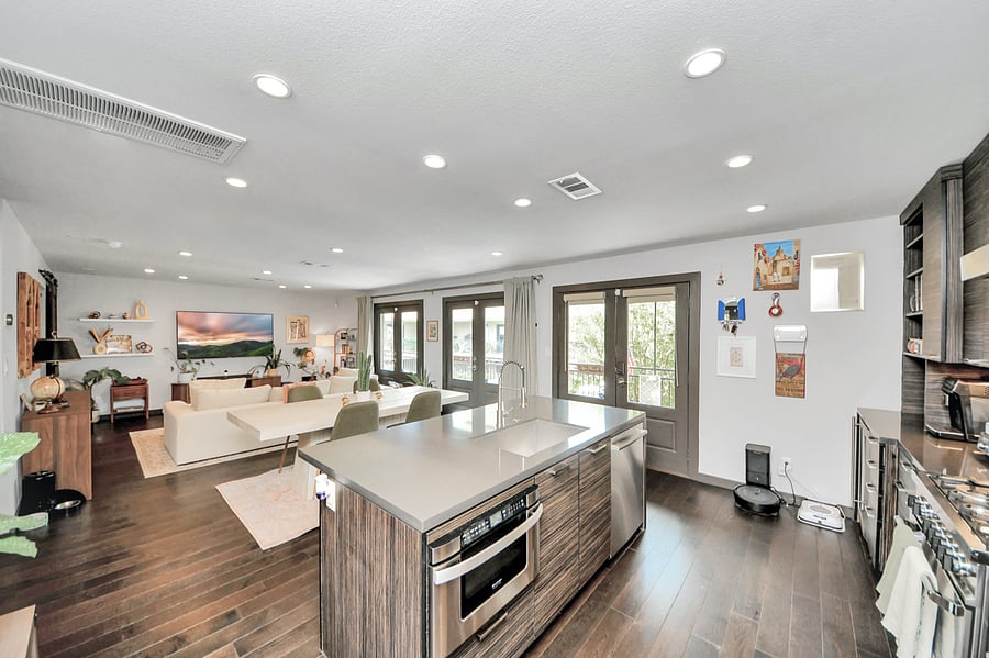 Enjoy group meals in style. This bright, open dining area features a bold contemporary table, comfortable seating, and seamless flow right into the kitchen and living spaces