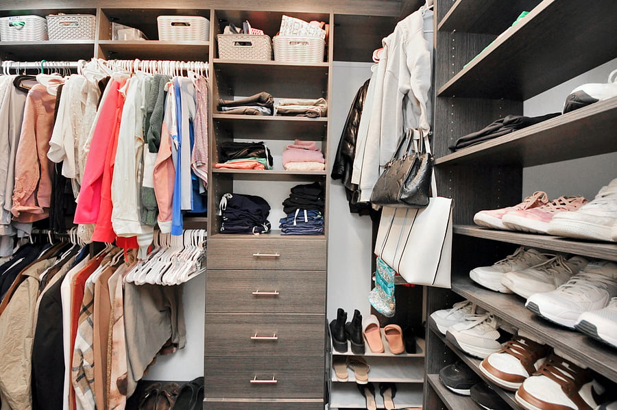 Discover custom organization bliss! This massive walk-in closet offers endless storage for longer stays, with extensive hanging space, shelves, and dedicated drawers.