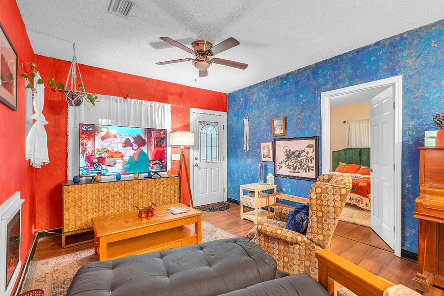 Living Room - electric fireplace, large TV, futon, recliner.