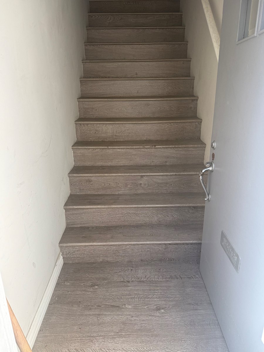 Stairs leading into upstairs apartment 