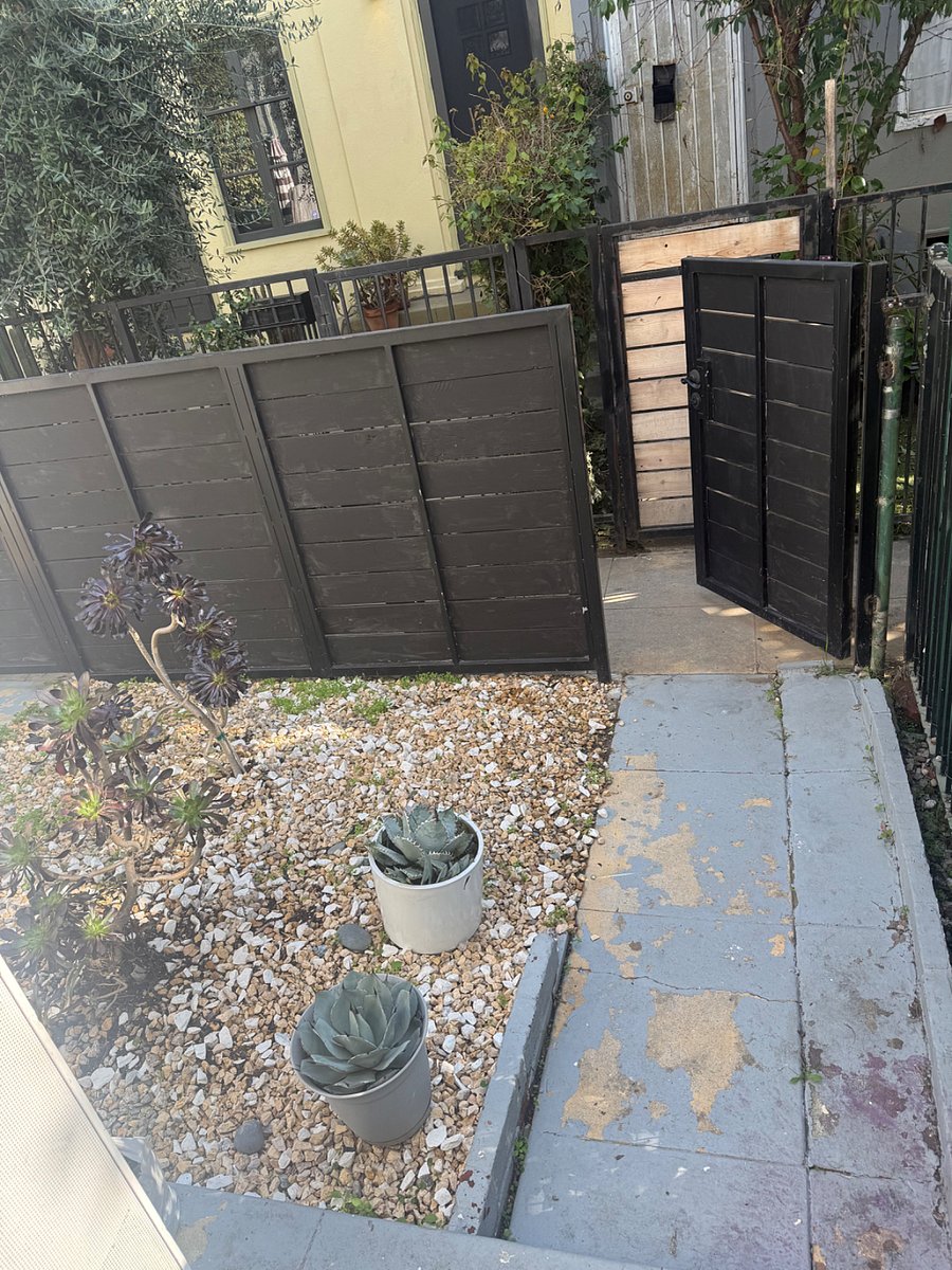 Front entrance with small yard and gated . 