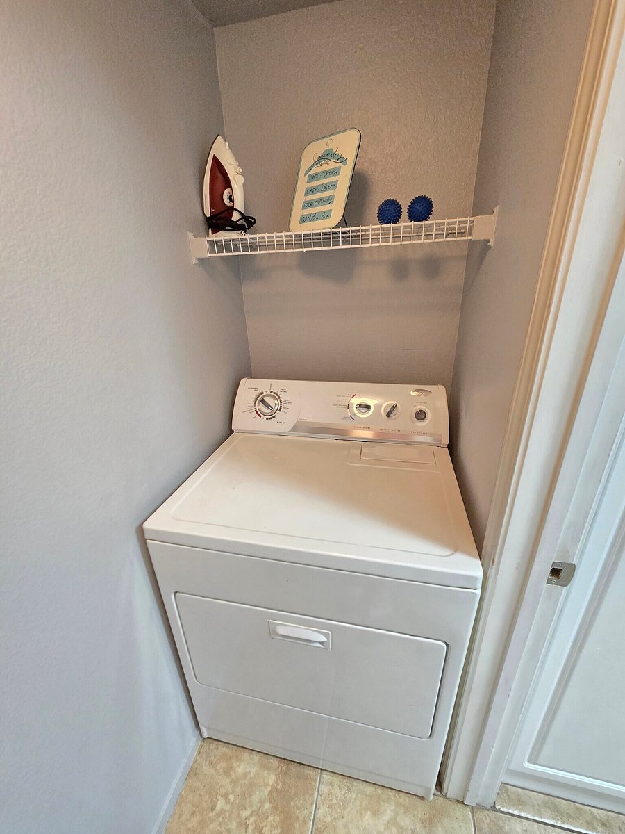 Dryer in closet by kitchen