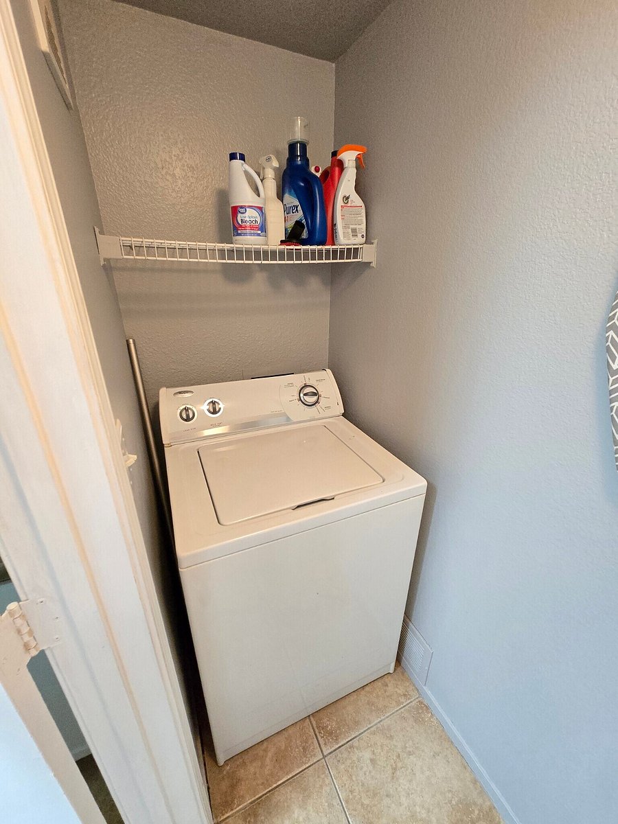 Washer in closet by kitchen