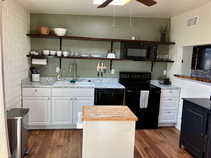 Kitchen includes oven, dishwasher, and microwave