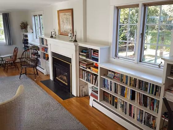Extensive book collection w/cozy fireplace
