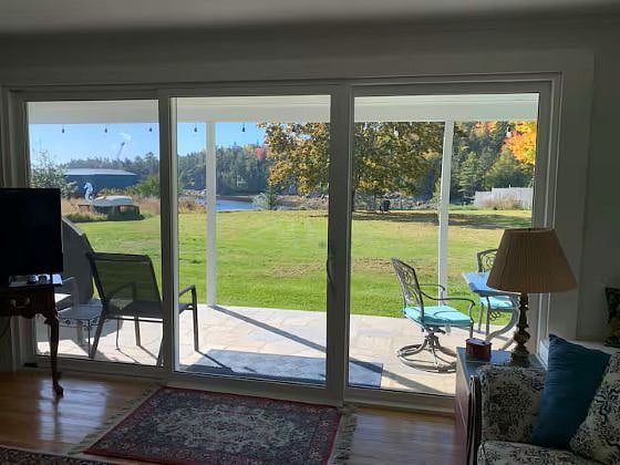 View from Living Room over large yard to the water