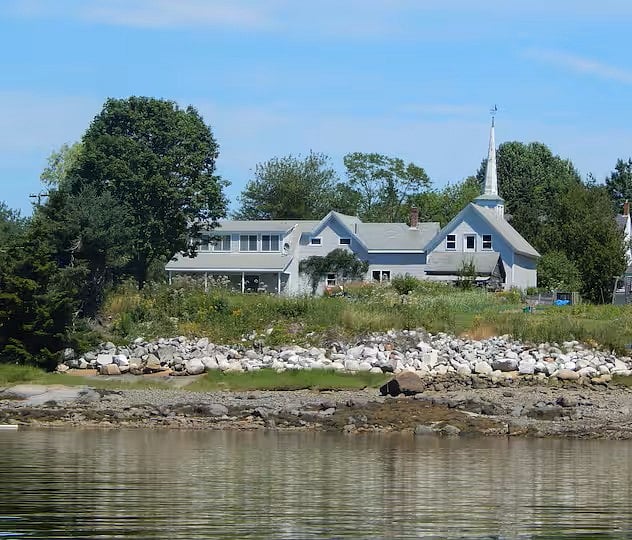 View of house and barn from the water