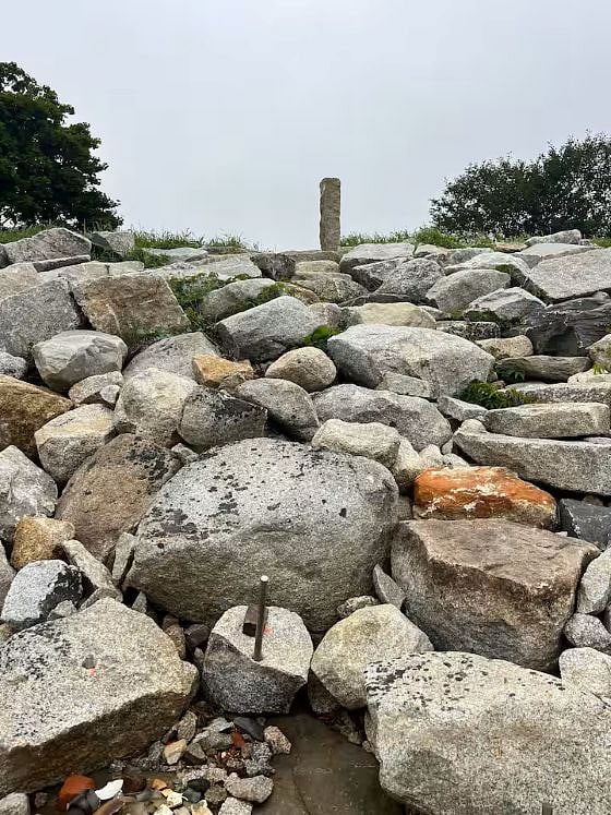 New granite embankment at the end of the lawn