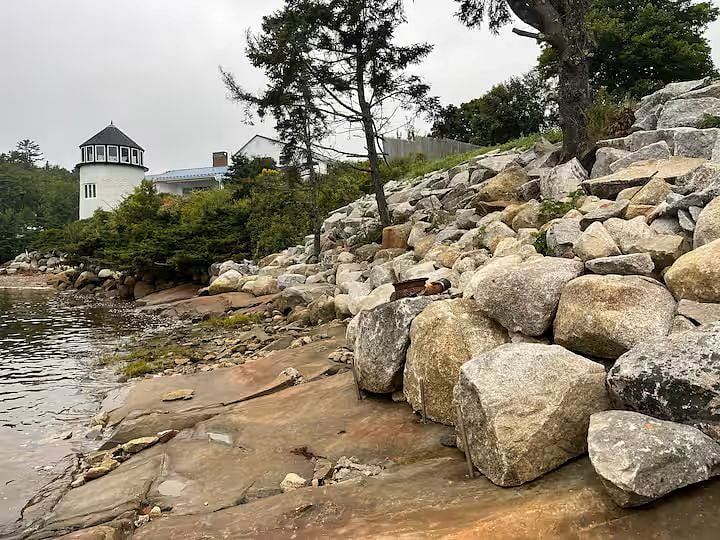 Granite embankment with built in steps and view of "Lighthouse"