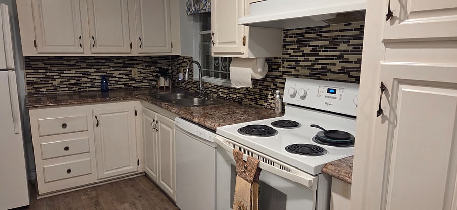 Well appointed kitchen including microwave, coffee maker, toaster, dishwasher.  Pots, pans, dishes, etc.