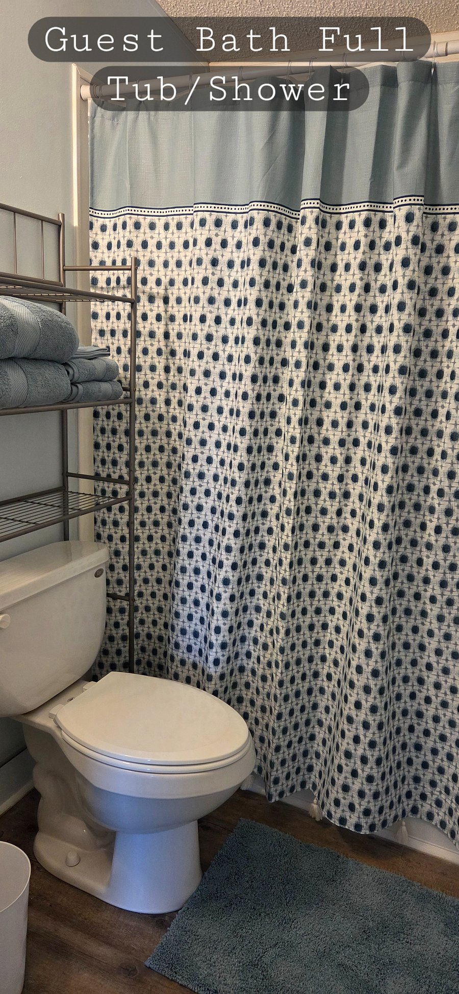 Guest bathroom has full bath and shower.