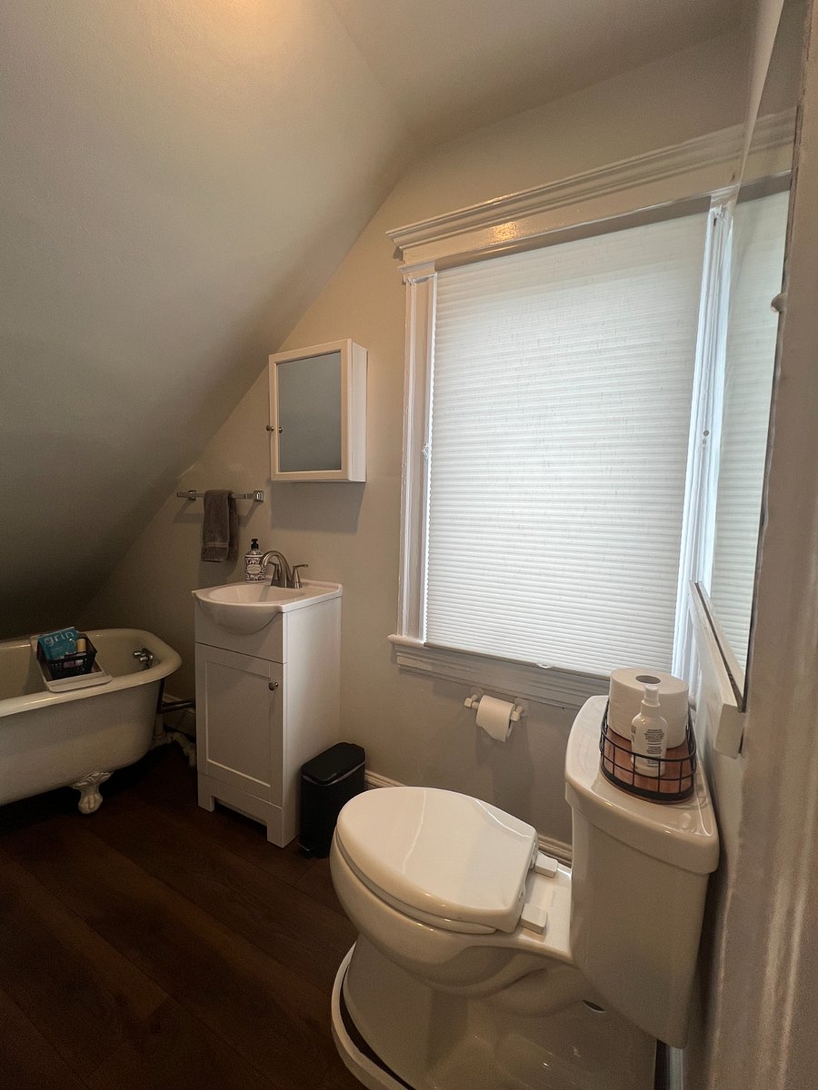 Full bath with shower and claw foot bathtub.
