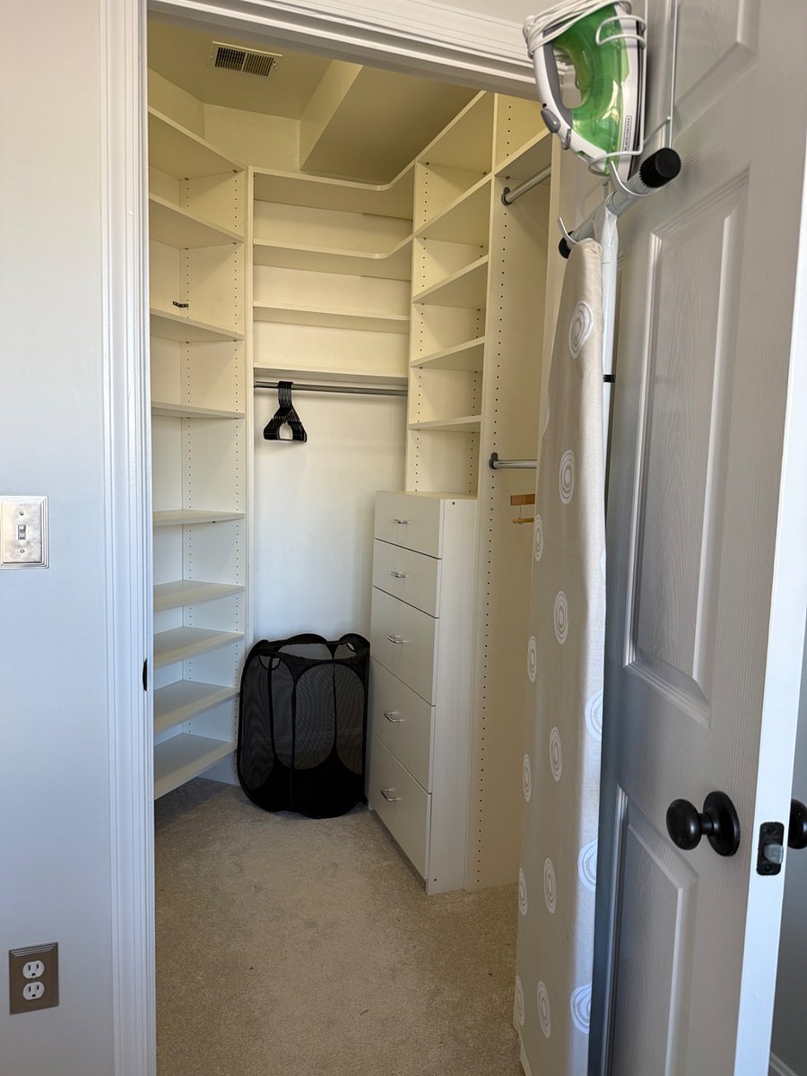 Guest bedroom closet with hamper