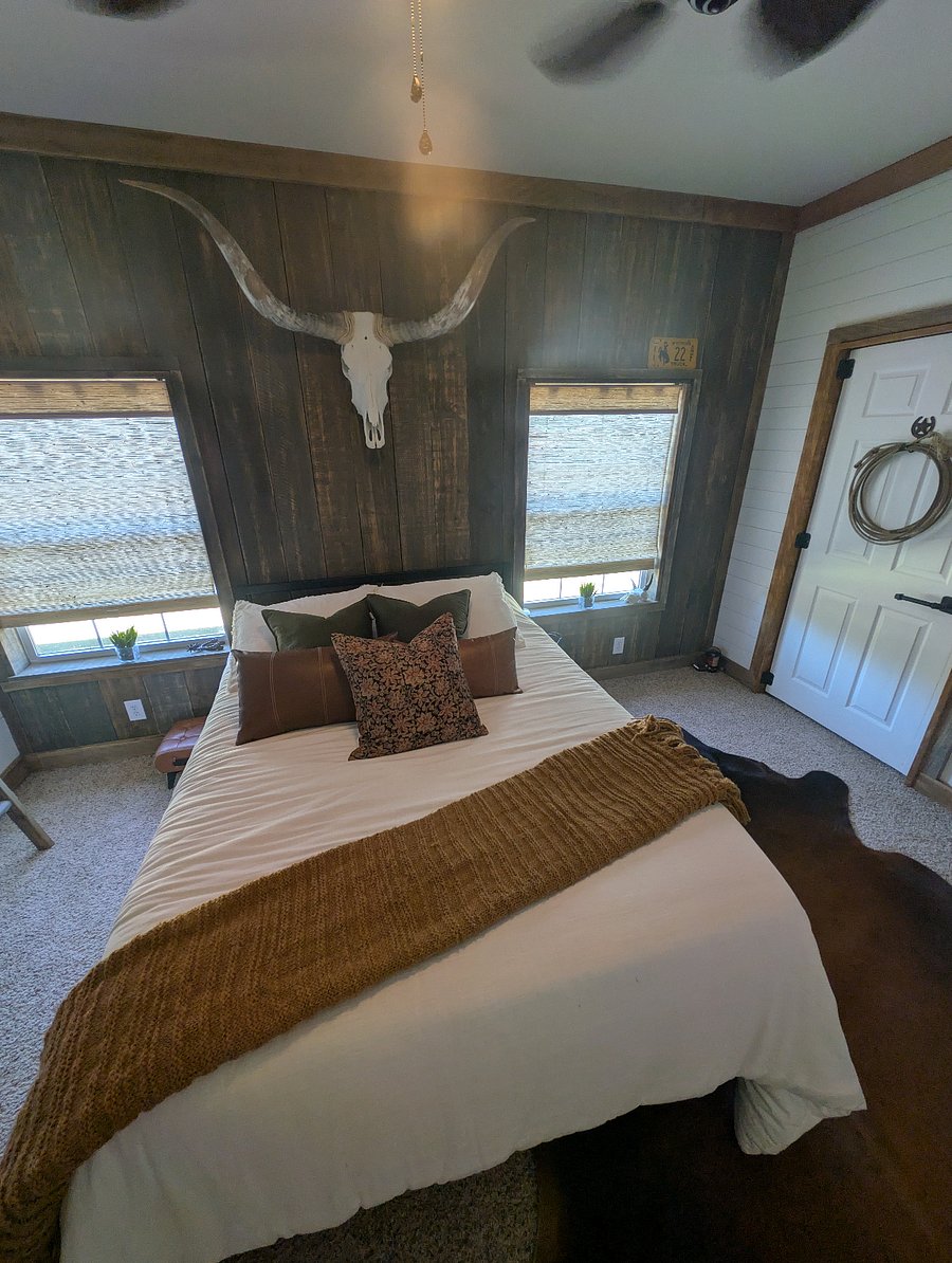 Queen size bed with water view out both windows
