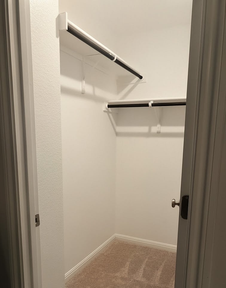 Blue bedroom has a walk-in closet.