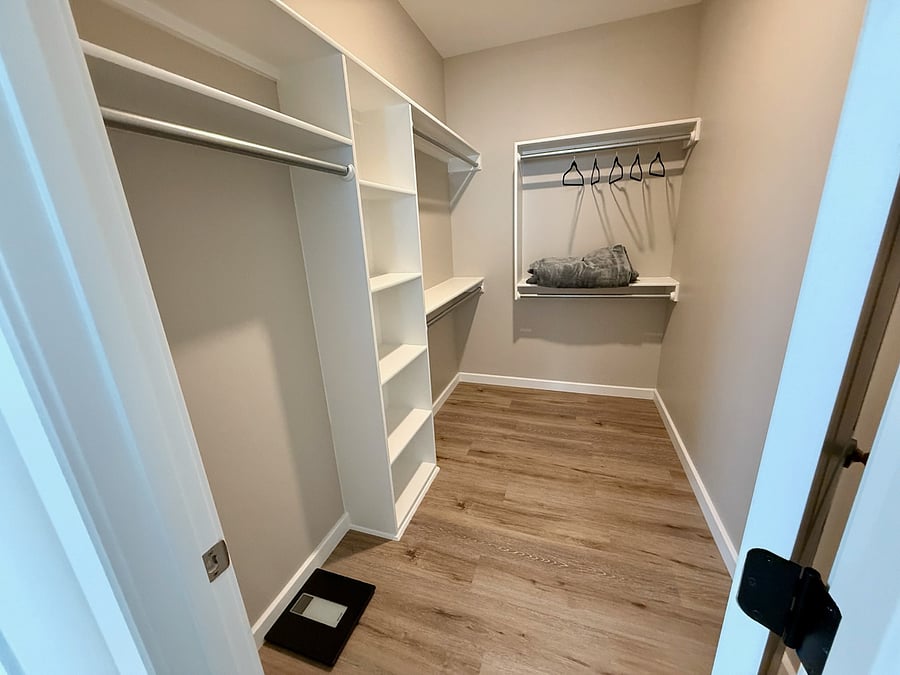 Huge walk-in closet in the master bedroom with plenty of hanging space, built-in shelving, a full-length mirror, and a scale. Room for all your luggage, and personal items.