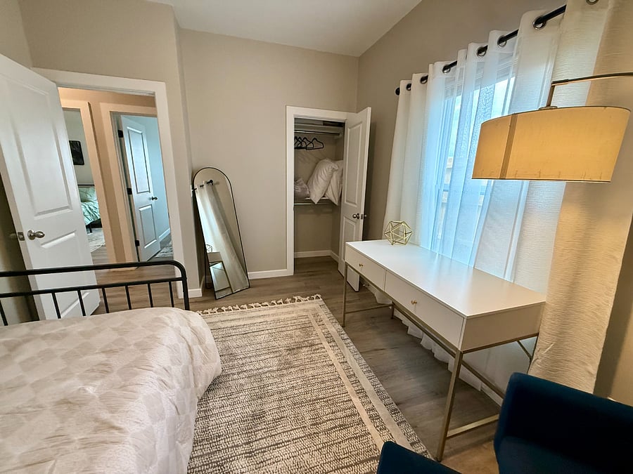 Versatile third bedroom set up as a private office + guest room. Features a comfortable twin Xl bed with pull out bed under. Fresh sheets, comforter, and pillows stored in the closet for the pull-out. Large desk which is perfect for charting, remote work, or studying. Closet with hangers, shelving, and an extra warm blanket!