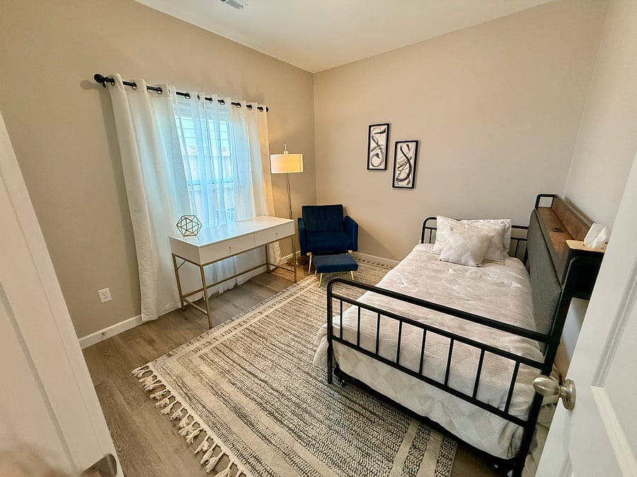 Versatile third bedroom set up as a private office + guest room. Features a comfortable twin Xl bed with pull out bed under. Fresh sheets, comforter, and pillows stored in the closet for the pull-out. Large desk which is perfect for charting, remote work, or studying. Closet with hangers, shelving, and an extra warm blanket!
