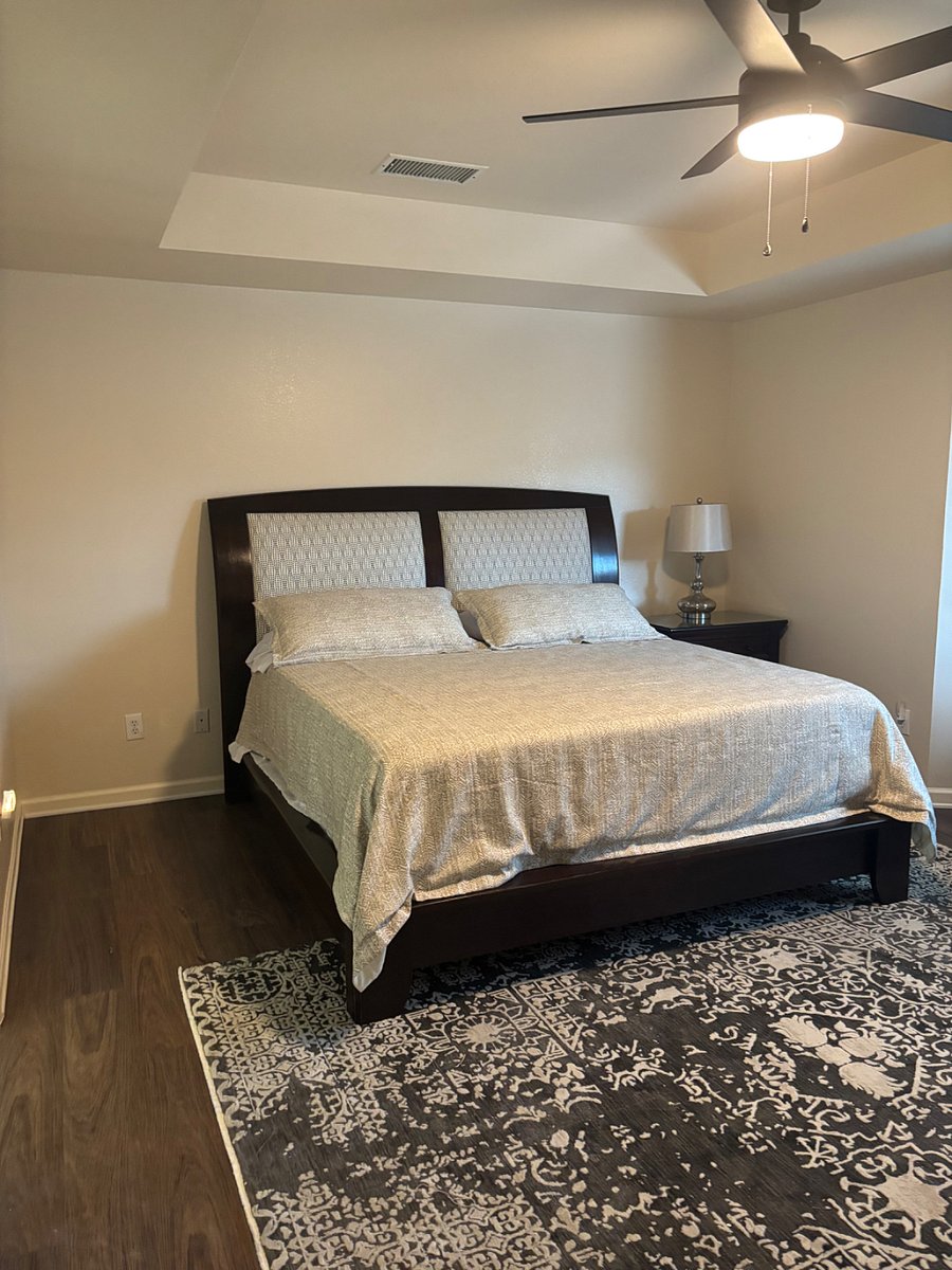Master bedroom with king size bedroom, private bedroom, sitting area, floor length mirror and fireplace 