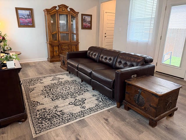 Living room open to kitchen and dining area.