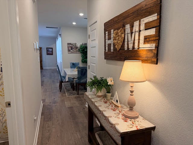 Entry hallway to 1 bedroom, 1 full bath, living area, dining, and living room. 