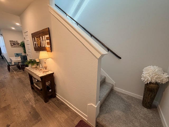 Entry hallway to 1 bedroom, 1 full bath, living area, dining, and living room. Stairs leads to 2nd floor Media room, and 4 additional bedrooms, and 3 full baths.