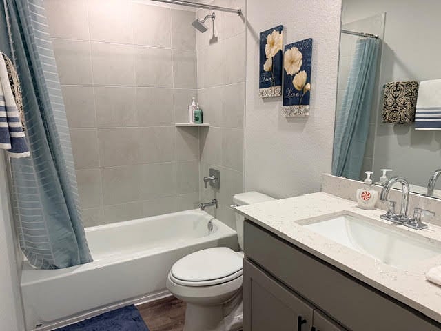 attached private, full bathroom with the ensuite bedroom or 2nd primary bedroom with a bathroom inside the room and a walk-in closet