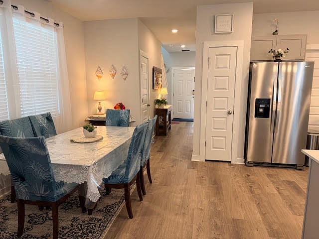 1st Floor hallway to front door, 1 bedroom by the entry, 1 full bathroom next to the bedroom on the hallway, a storage closet by the stairs, hallway leads to the dining area, kitchen, living room, side door to the covered patio in the private yard.