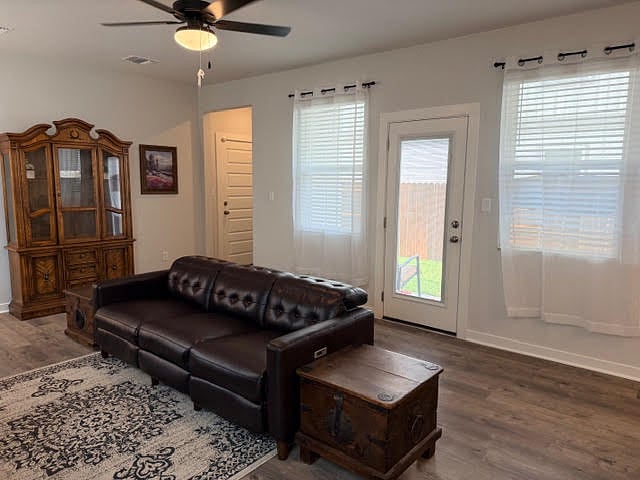 Shared Living room fully furnished and open to kitchen and dining area. Ceiling fan with lights, lots of windows with 2" faux blinds and window coverings.
