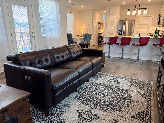 Shared Living room fully furnished and open to kitchen and dining area. Ceiling fan with lights, lots of windows with 2" faux blinds and window coverings.