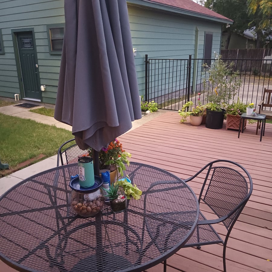 Enjoy your wine or beer with friends in this spacious entertaining deck. Umbrella has solar lights for night use.